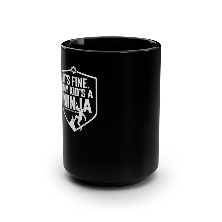 Black 15oz Mug — “It’s Fine, My Kid’s a Ninja” Parent Coffee Cup